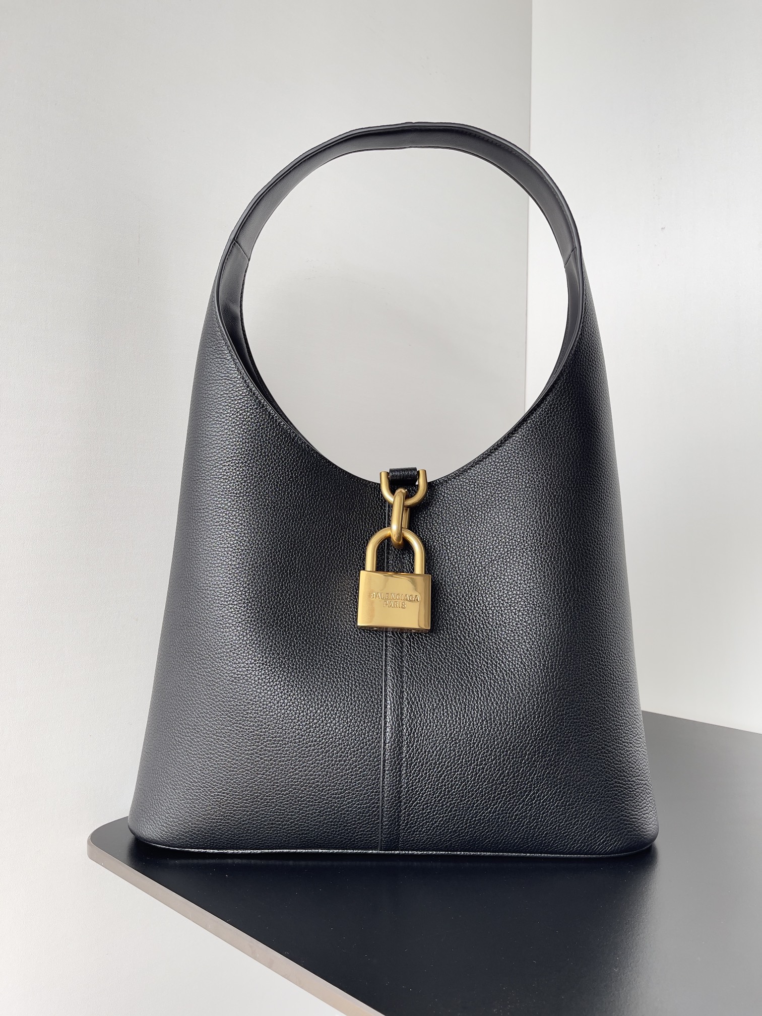 BALENCIAGA North-South medium embellished textured gold