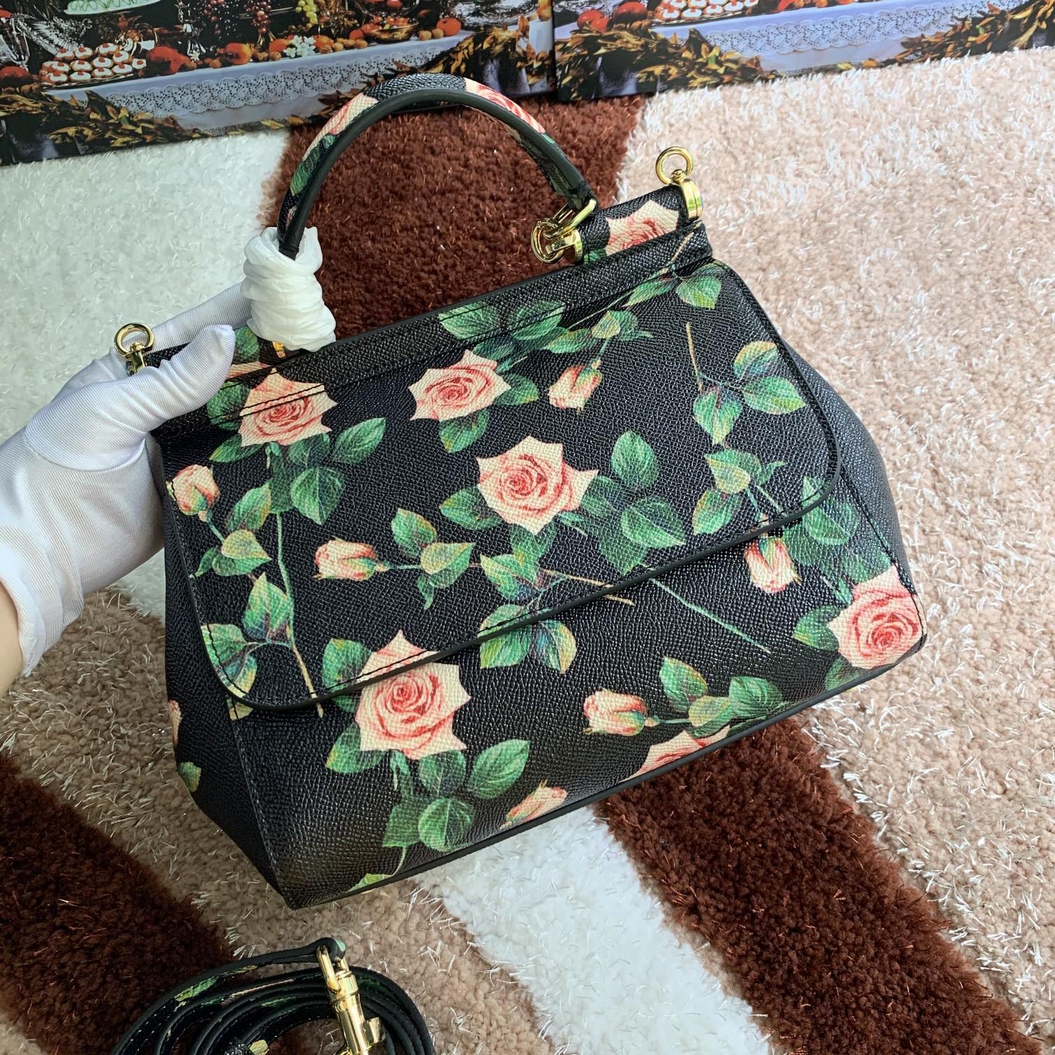 Dolce & Gabbana Satin Sicily bag with rose print on a black background in Print
