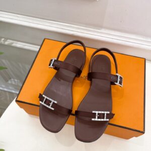 Hermès dark brown leather slippers with silver H buckle