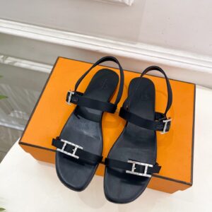 Hermès dark black leather slippers with silver H buckle