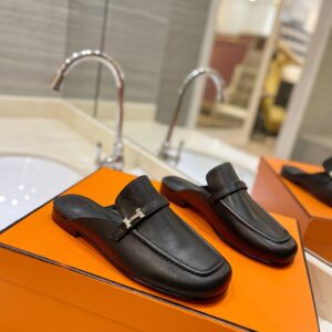 Hermès Men’s Black Leather Mules with Palladium-Plated Kelly Buckle
