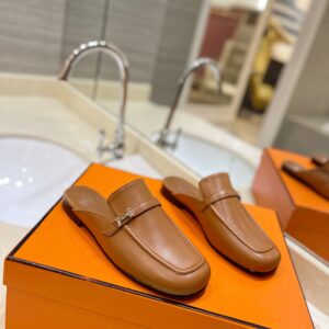 Hermès Men’s Leather Mules in Brown with Palladium-Plated Kelly Buckle