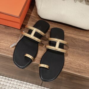 Hermès Black and Gold Vibrant Sandals Flip Flops
