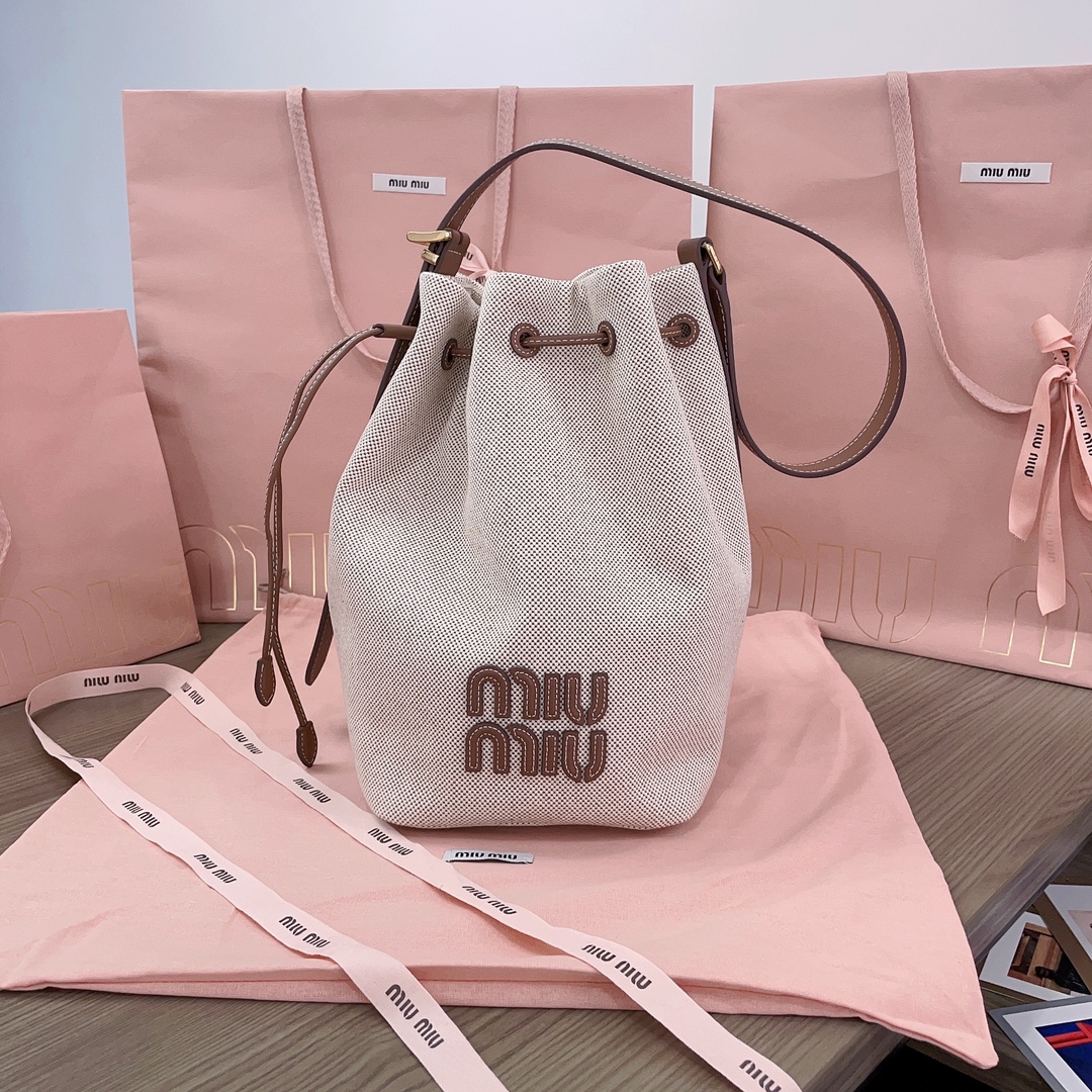 Miu Miu Logo leather-trimmed bucket bag in beige – Miu Miu |