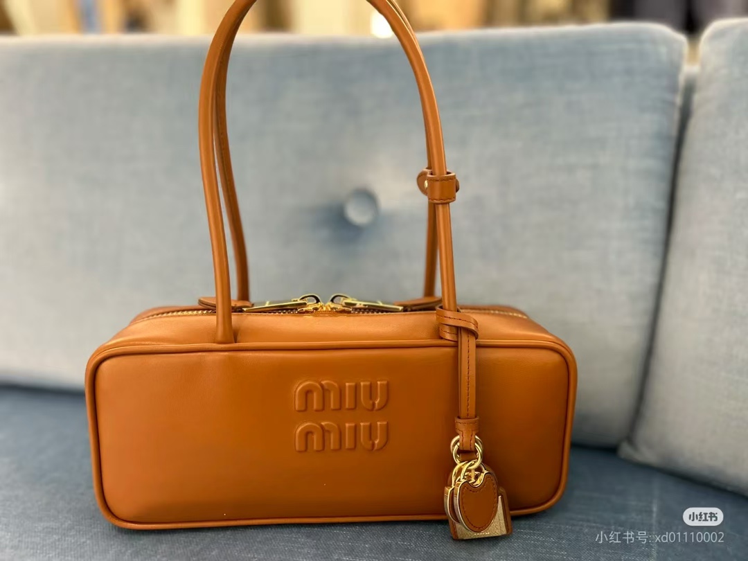 Miu Miu Beau logo embossed leather tote bag in brown – Miu Miu | Mytheresa