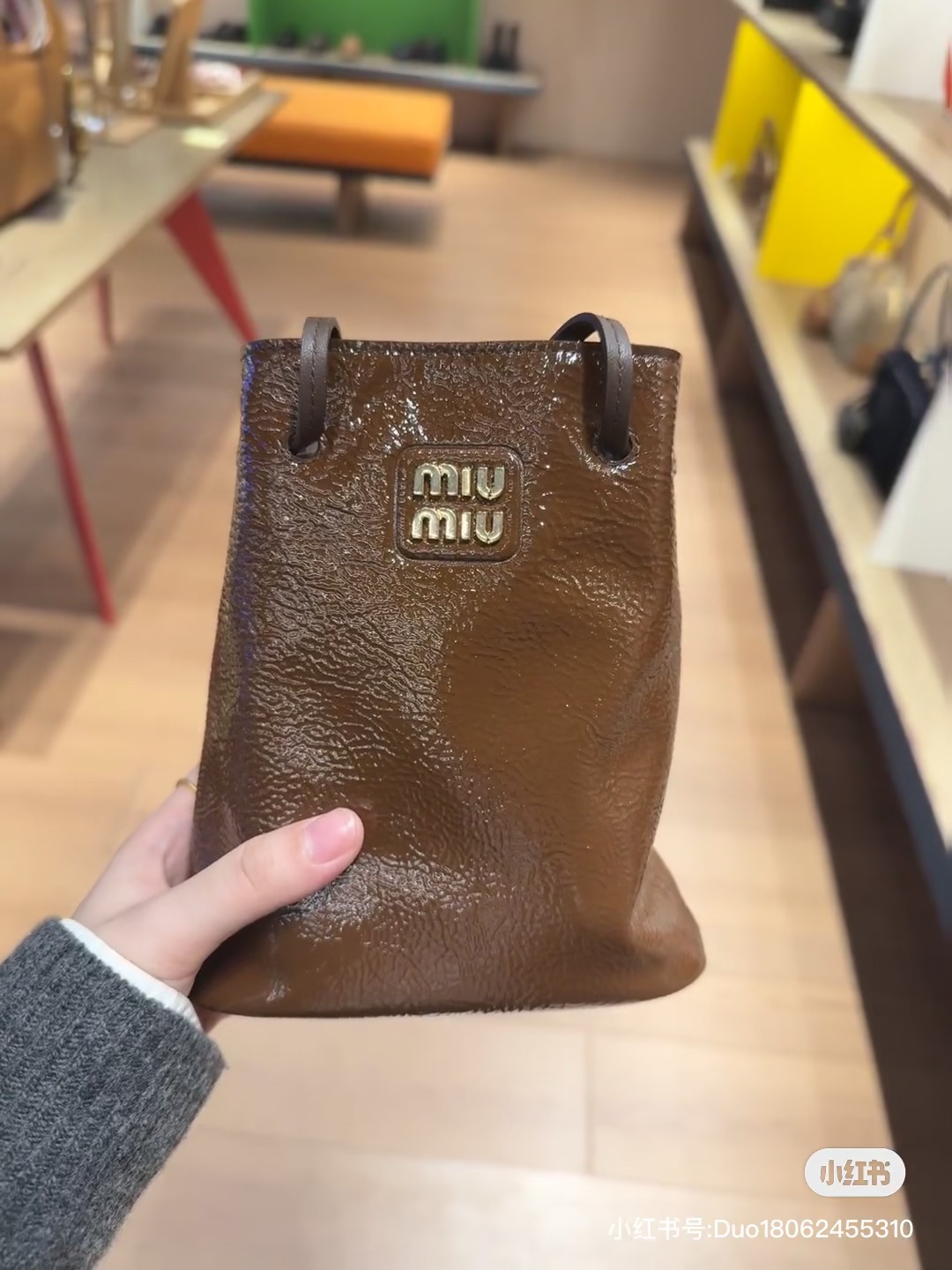 Miu Miu Naplak Patent Leather Pouch in Brown |