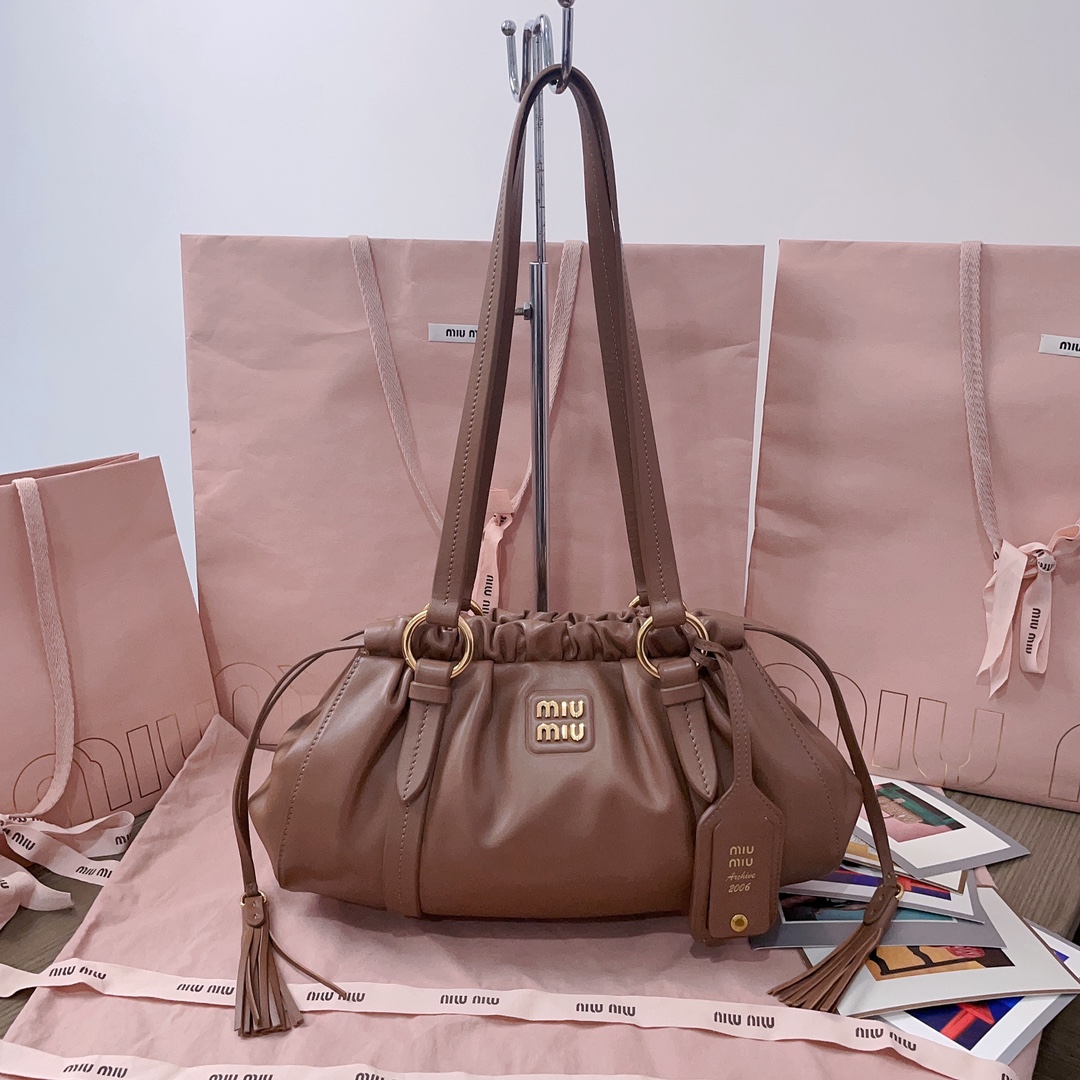 Miu Miu Logo-Lettering Drawstring Shoulder Bag In brown