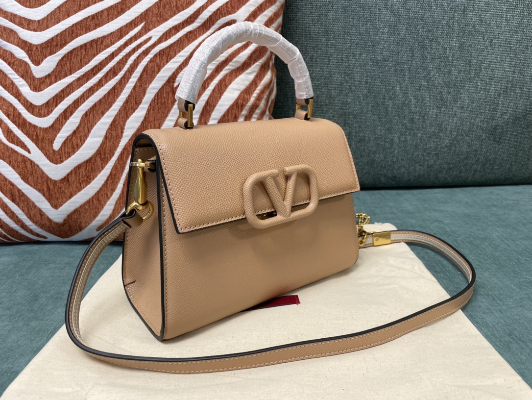 Valentino Garavani Small VSling Leather Handbag | Neutral