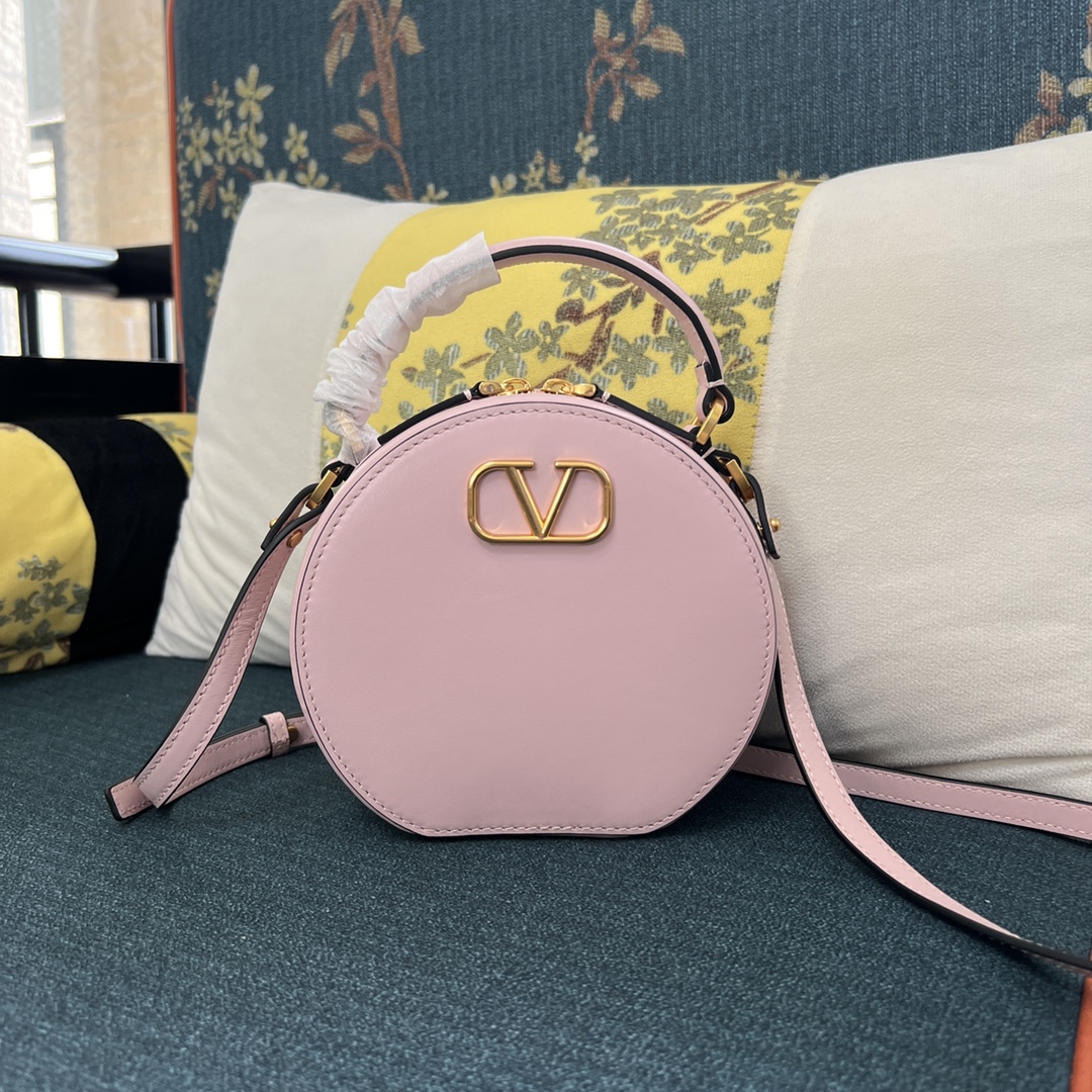 Valentino Garavani Vlogo Round Crossbody Bag in Pastel Pink