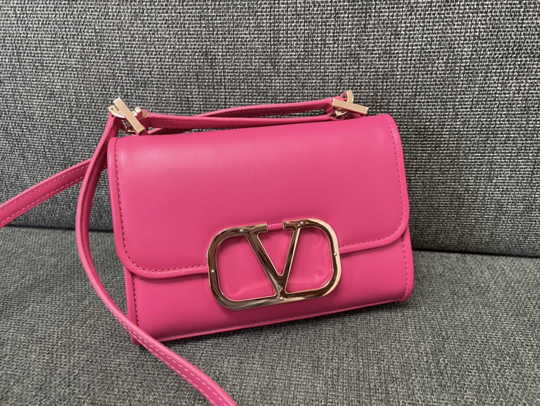 Valentino Garavani Logo Leather Shoulder Bag on pink